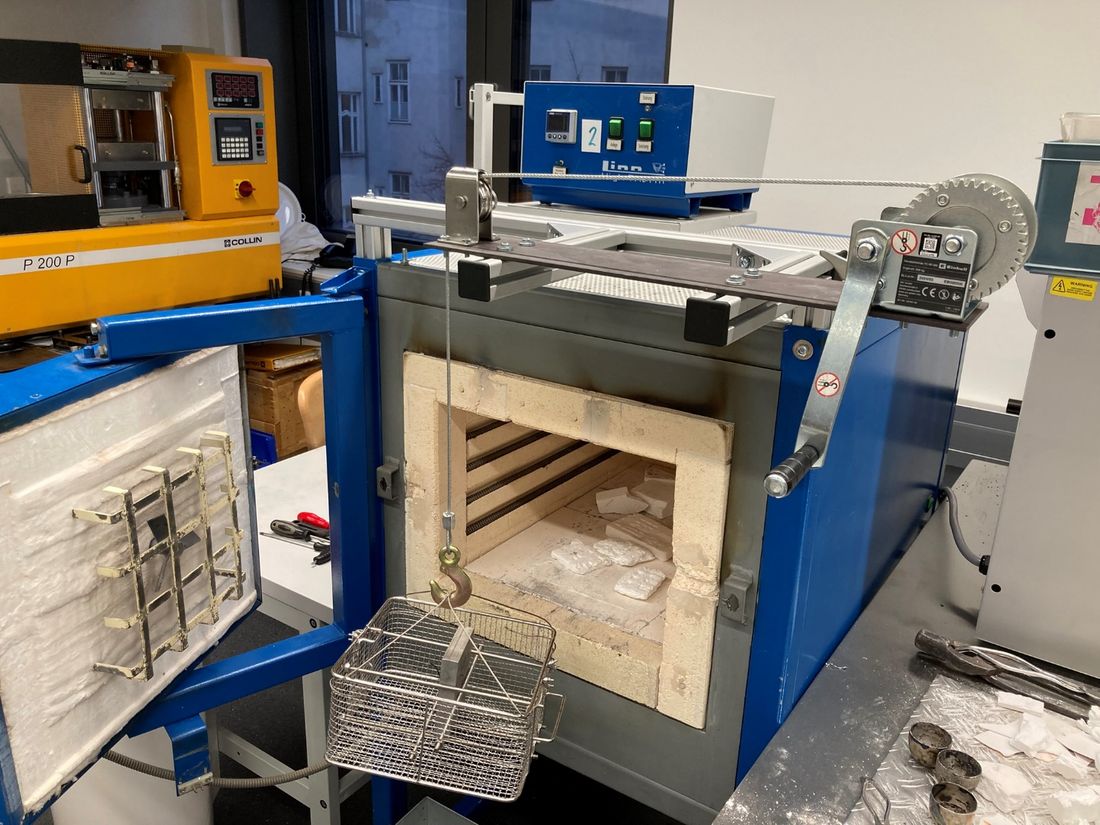 Solution annealing furnace with the quenching device and cable winch used to lower the components into the water bath.